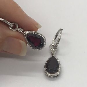 .925 Silver Garnet earrings with Diamond accents.